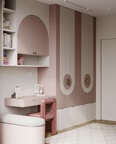 a room with pink and white decor on the walls