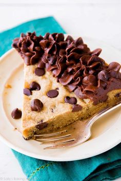 a piece of chocolate chip pie on a plate with a fork