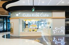 the interior of a children's cafe with neon lights