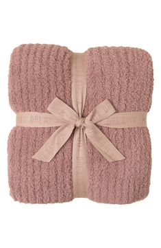 two pink towels tied up to each other with a bow on the front and bottom