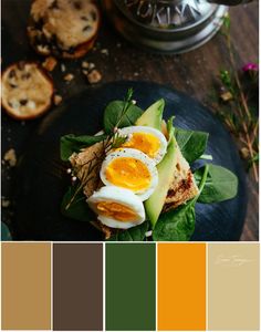 an egg and avocado sandwich is on a plate with some other food in the background