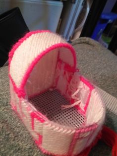 a pink and white object sitting on top of a table