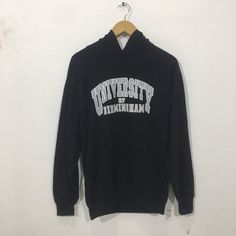 "*ITEM: Vintage 90s University Of Birmingham Small Vintage 1990s University OF Birmingham Hoodie Sweater Size S *ITEM DETAILS: 👇🏻 Please be aware that all vintage items will usually show a few signs of wear or fading due to age, but anything visible such as stains or holes, and serious flaws have been photographed.For any further information on this item please contact us and we will be happy to help. *SIZE: SMALL *ACTUAL SIZE MEASUREMENT: 👇🏻 *PIT TO PIT(WIDTH):22\"INCHES *LENGTH(FROM SHOULD Vintage Black Hoodie With Letter Print, Black Vintage Hoodie With Letter Print, Vintage Hoodie For Streetwear In Fall, Vintage Fall Sweatshirt For Streetwear, Vintage Fall Streetwear Sweatshirt, Vintage Hoodie With Drawstring Hood For Streetwear, Vintage Winter Hoodie With Letter Print, Vintage Hoodie For Fall Streetwear, Vintage Letter Print Hoodie For Winter