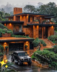 a jeep is parked in front of a large house with trees and bushes around it