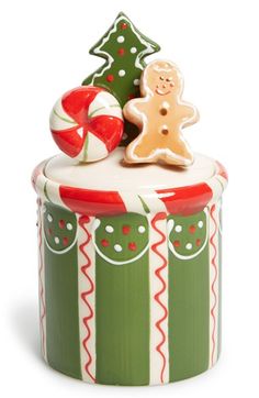 a gingerbread cookie on top of a green and white container