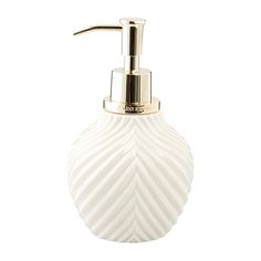 a white glass soap dispenser with a metal faucet on it