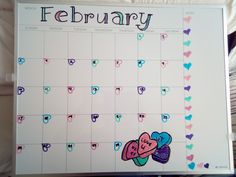 a calendar with hearts on it and the word february written in cursive writing