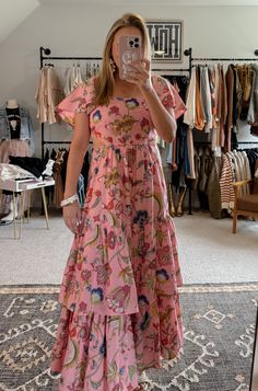 Get ready to bloom in the Blossom Tiered Ruffle Dress! This gorgeous maxi dress features a stunning floral print, combining shades of pink, blue, yellow, green and magenta. With ruffle sleeves, a tiered skirt, and subtle side cut outs, this dress flatters any figure. The elastic waist and back ensure a comfortable fit. Perfect for any occasion, this dress is a must-have in your wardrobe. (P.S. It's true to size - no need to guess!) I'm in a small. Western Frocks, Summertime Dresses, Gorgeous Maxi Dresses, Tiered Ruffle Dress, Pink Blue Yellow, Pink Girly Things, Denim Accessories, Style Maxi Dress, Shades Of Pink