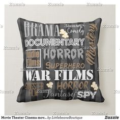 a black pillow with the words drama and movies on it in different languages, sitting against a white wall