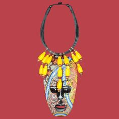 Sunshine Tribal Mask Necklace This necklace has vibrant yellow colour beads and ornate mask pendant. Outfit Ideas For Black Women, Cowrie Shell Jewelry, Magic Dress, Lace Weave, Mask Necklace, African Necklace, Handmade Jewelry Necklace, Yellow Colour, Rings Jewelry Fashion