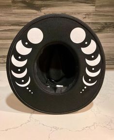 A sturdy thick 100% polyester hat. I have applied white moon phases. Get your witchy vibe on. It has adjuster inside. Black Zip Up Hoodies, Witchy Hats, Crafty Fashion, Moon Hat, Witchy Hat, Bling Sunglasses, Hat Inspiration, Wide Brimmed Hat, Plastic Mask