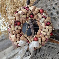 a wreath made out of wine corks and ornaments