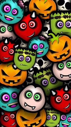 a bunch of different colored skulls and pumpkins with faces on them, all grouped together