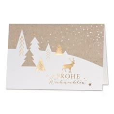 a christmas card with gold foil on the front and white paper in the back that says,