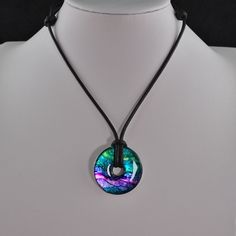 a necklace that has a circular pendant on it