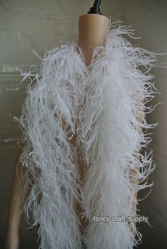 a mannequin with white feathers on it