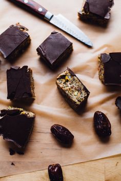 several pieces of chocolate sitting on top of a wooden table