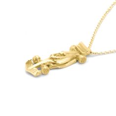 The Race Car Necklace is a stunning piece that captures the essence of speed and adrenaline. Crafted from 14K gold, this necklace features a sleek and aerodynamic race car design complete with intricate details. The streamlined body of the car creates a sense of movement and energy. The wheels of the car are finely detailed and perfectly balanced, ready to take on any race course. Race Car Necklace● 14K gold Formula 1 Necklace, Ferrari Jewelry, Ferrari Necklace, Car Necklace, F1 Necklace, F1 Jewelry, F1 Gifts, Car Jewelry, Queen Jewelry