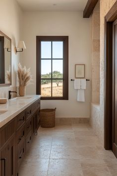 a large bathroom with double sinks and two mirrors