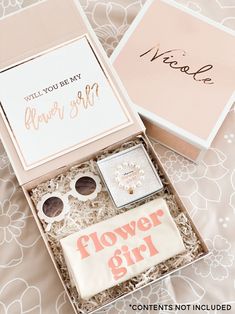 a box with some flowers and other items in it