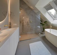 a bathroom with a skylight and a bathtub