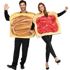 a man and woman in costumes holding peanut butter and jelly sandwich slices with chocolate spread on them