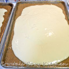 two pans filled with food sitting on top of a table