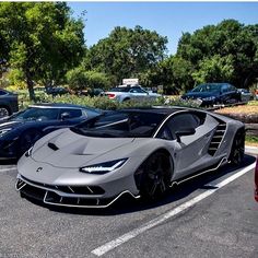 several cars parked in a parking lot next to each other