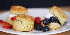 some biscuits and berries on a white plate