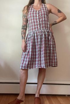 Cotton sundress with racer back and 2 front hip pockets.  MEASUREMENTS Bust 38 Waist 34 Hips 54 Length from top of shoulder to waist 18 Length from waist to hem 21 CONDITION  Good. Minimal wear, no flaws Madras Plaid, Drop Waist Dress, Cotton Sundress, Dropwaist Dress, Waist Dress, Drop Waist, Racer Back, Dress Clothes For Women, Sundress