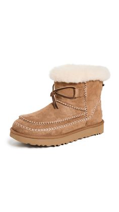 PRICES MAY VARY. Suede upper 17mm UGGplush wool lining with sheepskin collar Sugarcane EVA outsole 17mm UGGplush wool sockliner Fixed leather lace Ugg Classic Mini Boot, Ugg Leather Boots, Chelsea Boots Mens, Square Toe Shoes, Ugg Classic Mini, Womens Ugg Boots, Chelsea Boots Men, Slippers Cozy, Ugg Classic