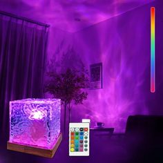 a living room with purple lighting and a remote control