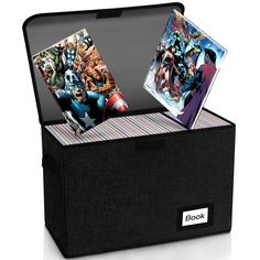 an open box with two pictures inside and the lid opened to show comic books in it