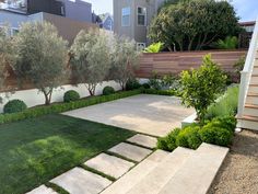 an outdoor garden with steps leading up to the house