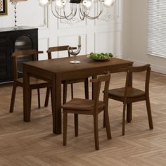 a dining room table and chairs in front of a chandelier with hanging lights