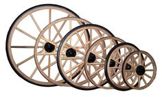 four wooden wheels are stacked on top of each other