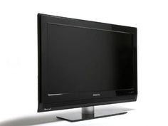 a flat screen tv sitting on top of a metal stand