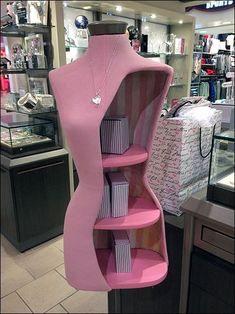 a mannequin display in a store filled with lots of boxes and other items