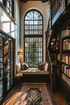 a room with bookshelves and a rug on the floor