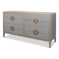 a grey and gold dresser with four drawers