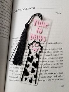 a bookmark with the words time to days and a cat on it in pink