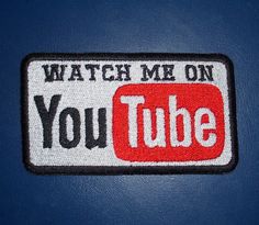 a patch that says watch me on youtube