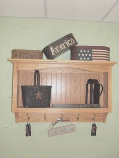 a wooden shelf filled with assorted items on top of a wall