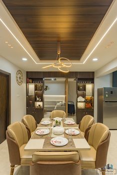 the dining room table is set with plates and place settings for six people to eat