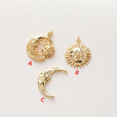 three gold charms with the word tove written below them and an image of a sun and moon