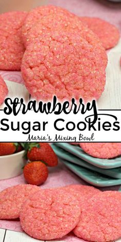 strawberry sugar cookies are stacked on top of each other with strawberries in the background