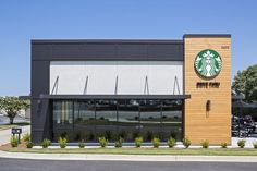 a starbucks coffee shop on the corner of a street