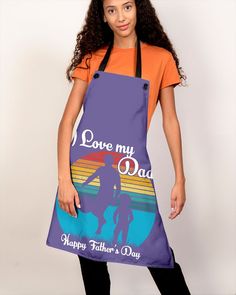 a woman wearing an apron that says, i love my dad happy father's day