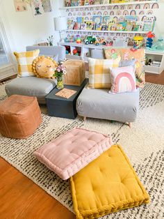 a living room filled with lots of furniture and decor