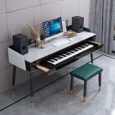 a computer desk with a keyboard, monitor and speakers